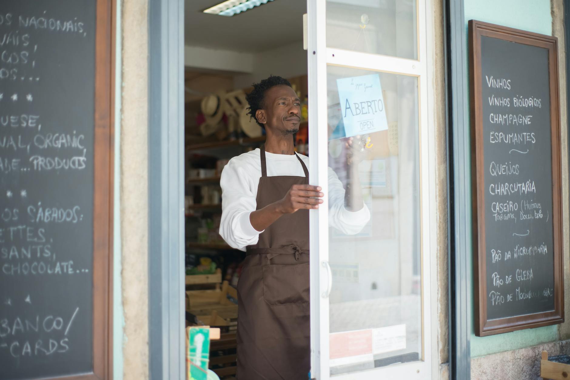 Small business owner opening shop door, ready to serve local customers and boost Google rankings