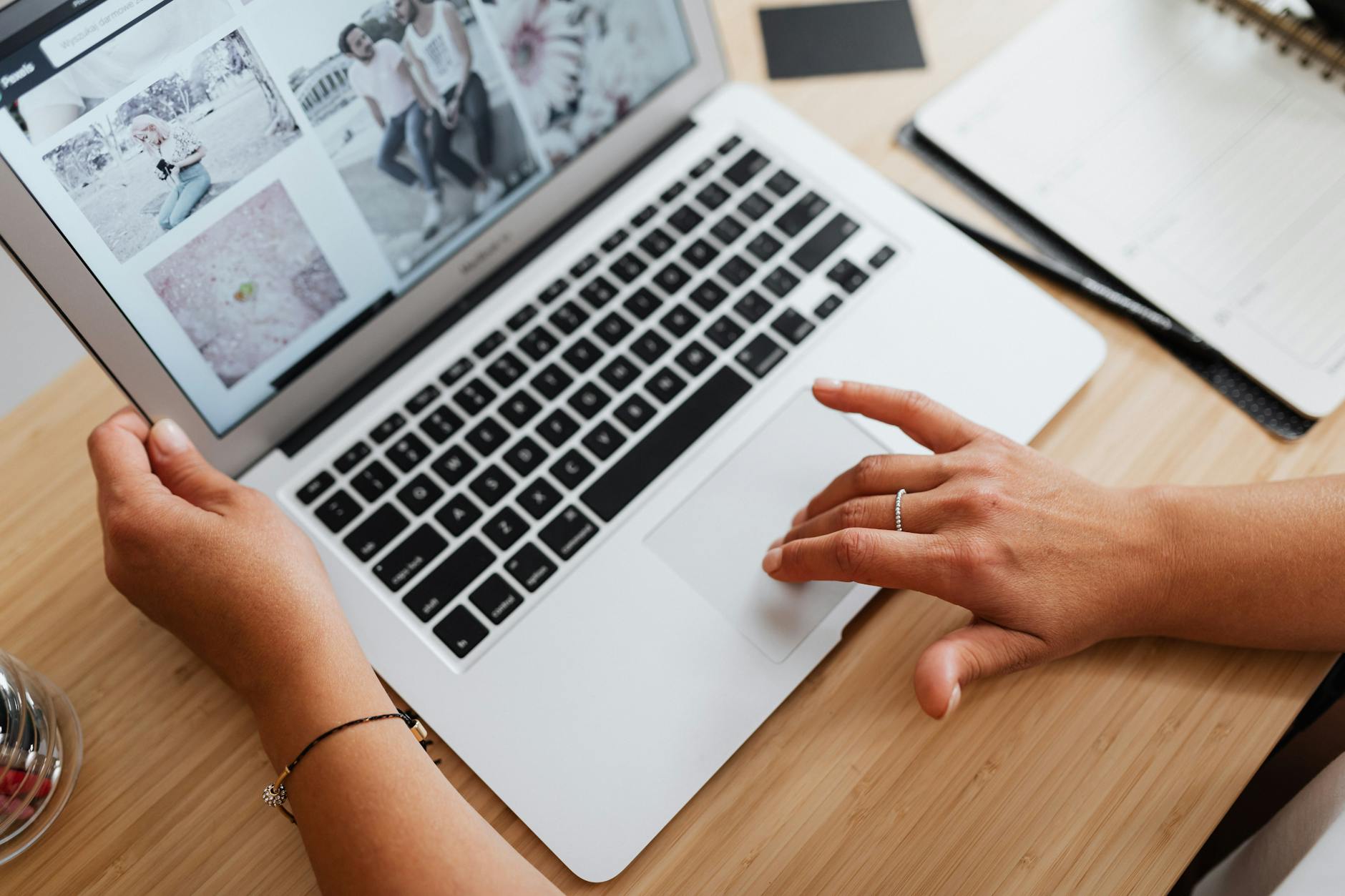 Small business owner reviewing paid media campaign performance on laptop screen